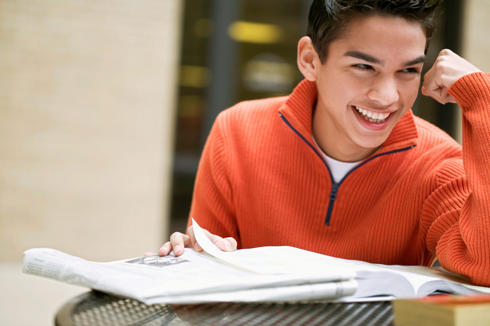 A smiling student feeling confident about their work